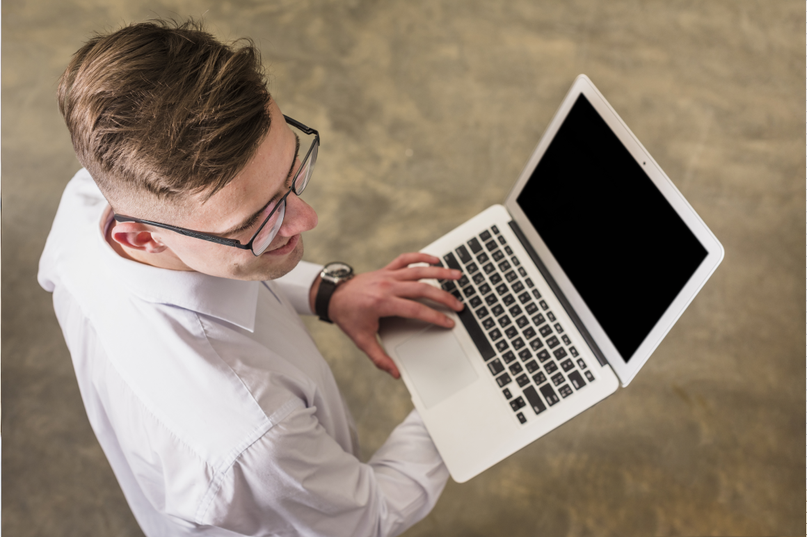 man holding laptop
