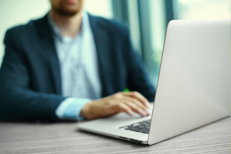 man writing laptop